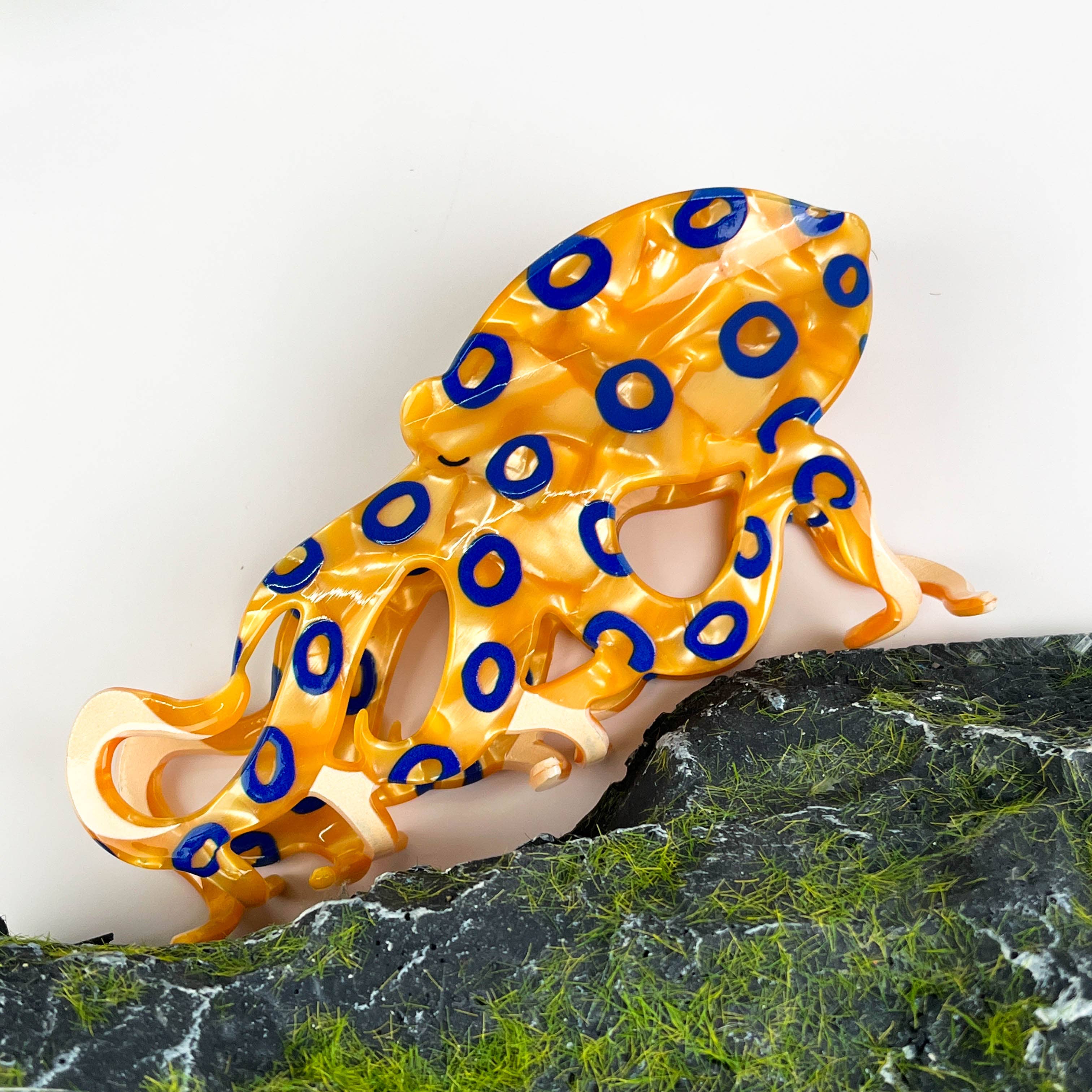 Pince à cheveux poulpe aux anneaux bleus