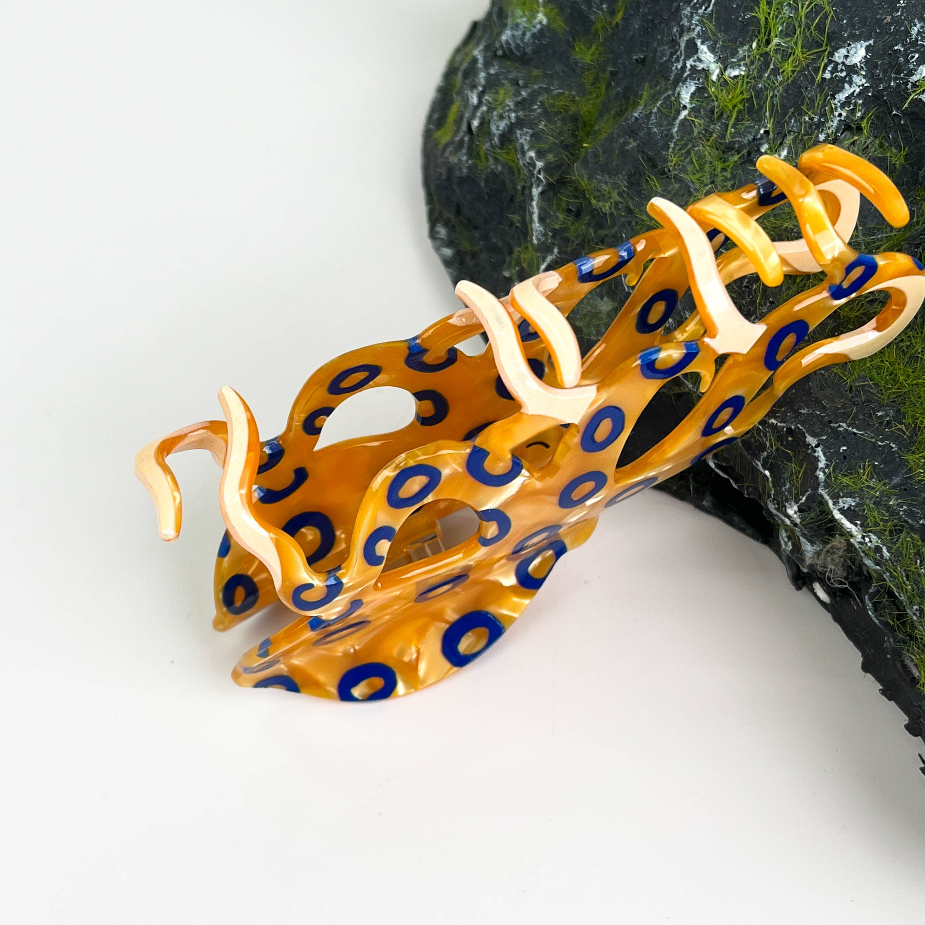 Pince à cheveux poulpe aux anneaux bleus