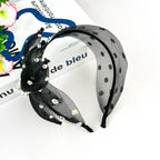 Bandeau en maille noire avec perles