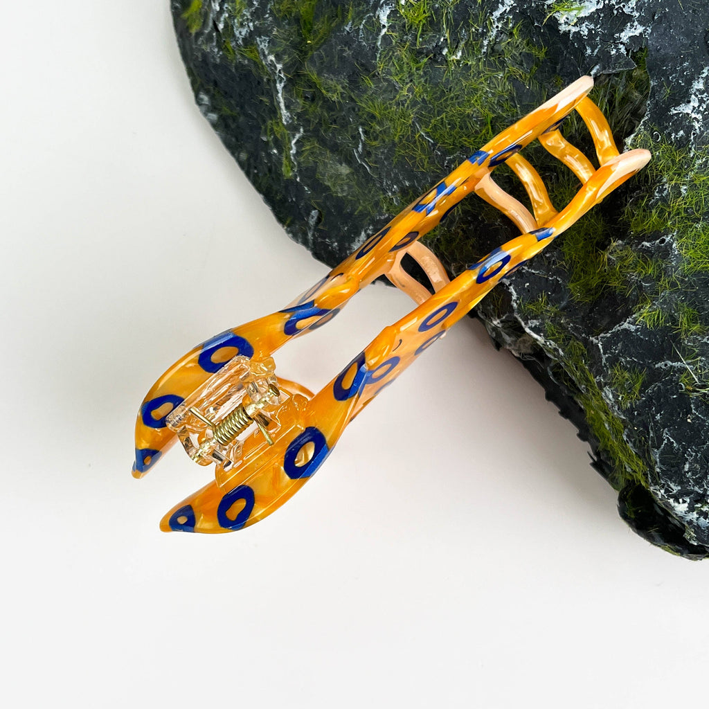 Pince à cheveux poulpe aux anneaux bleus